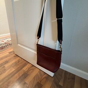 Nordstrom brand leather crossbody bag in Burgundy color. Adjustable web strap
